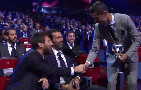 Lionel Messi congratulates Cristiano Ronaldo after winning