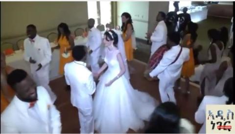 Bride and groom singing Ethiopian Orthodox Mezmur